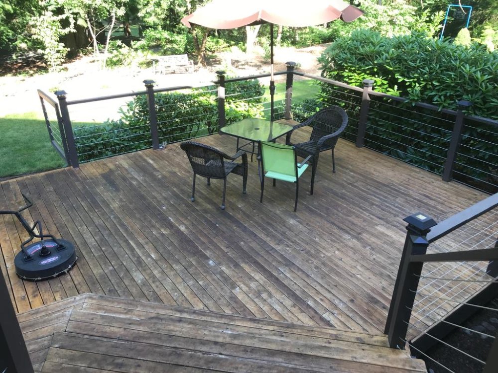 Deck before pressure washing services with Seattle Steamers