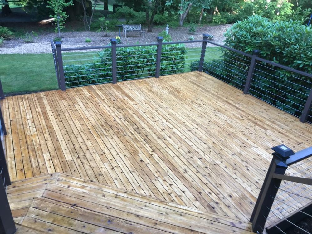 Clean deck after pressure washing with Seattle Steamers